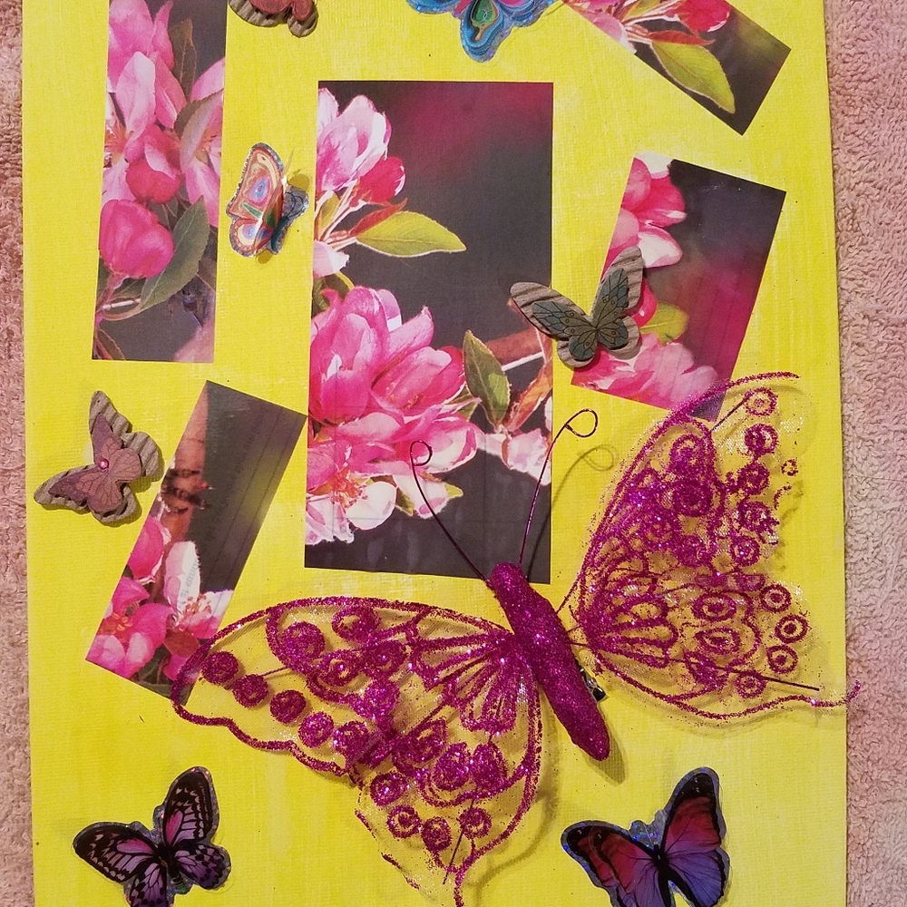 Handmade wall decor.  A decorative 9×12 canvas with wooden and plastic Butterfl